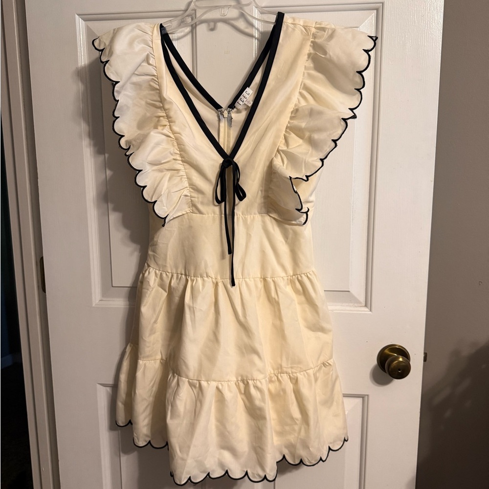 Charming Cream Dress with Black Trim